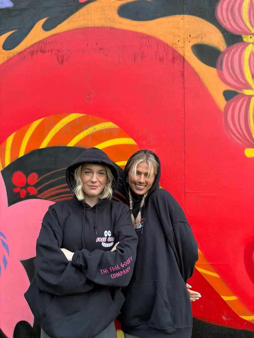 2 young women wearing Free Goofy hoodies